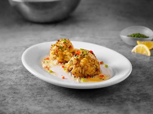 Sizzling Blue Crab Cakes - Served with lemon butter on a sizzling plate. Photo 2