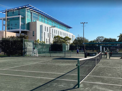 Tennis Center - Twelve Har-Tru Hydrogrid tennis courts, hitting wall, covered bench seating, and a locker room with showers. Offers lessons/clinics, tournaments, and evening play on lit courts. Photo 3