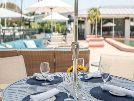 The Patio - Members and guests can relax on our open patio to read a book, sit around the fire with old friends, or attend a luau event. Photo 6