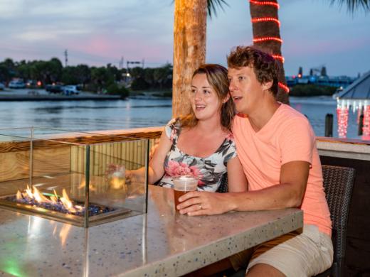 Fire Pit Tables-Tiki side - Fire pit tables with a view of the intercoastal under the new 4,000 square foot tiki Photo 3