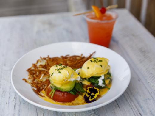 Beach Body Benedict - Eggs Benedict made with grilled tomato and sauteed spinach, avocado, poached eggs and Hollandaise. Photo 7