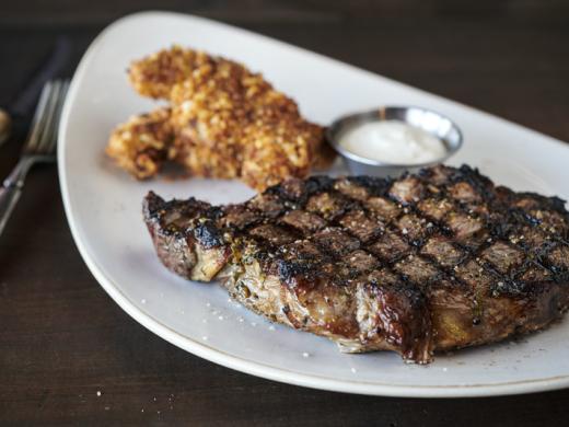 Aged Ribeye - 18-ounce Bone-In Ribeye, fire-grilled, served with creamy horseradish sauce Photo 4