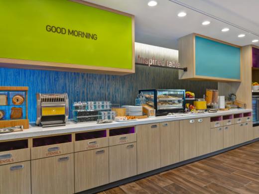 Oasis Breakfast Area - Complimentary Breakfast options of hot/cold items, cereal, fresh fruit, pastries, juice, milk, coffee and tea Photo 8