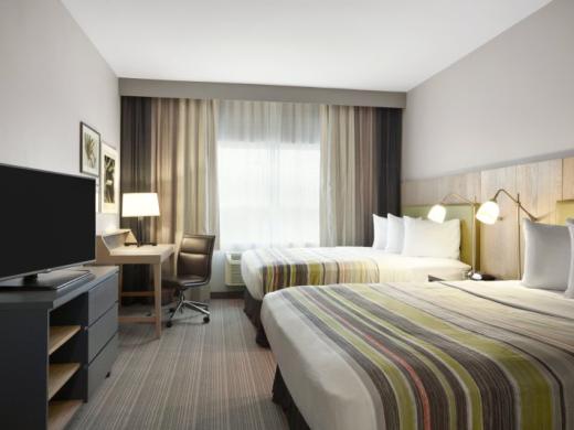 2 Queen size beds - 2 Queen size beds with Serta Perfect Sleeper Mattresses, 43" HDTV, microwave, refrigerator, coffee maker, free Wi-Fi and complimentary hot & cold breakfast buffet. Photo 6