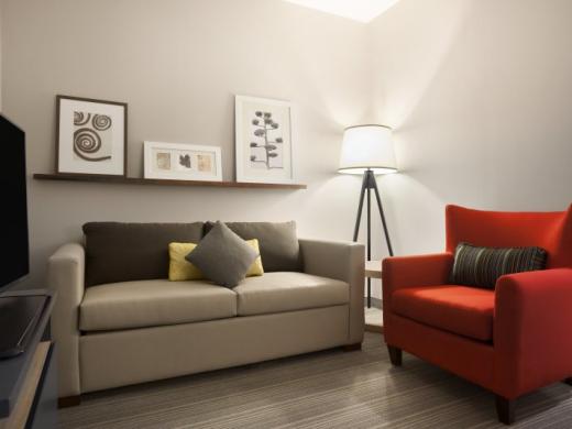 King Suite Living room - One bedroom king suite consists of a king size bed in the bedroom and comfortable pullout sofa in living room. Microwave, refrigerator, two 43" flat panel HDTVs, coffee mak... Photo 8
