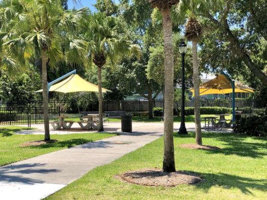 Fredd "Glossie" Atkins Park - Enjoy the day under the fabric shaded picnic tables and seating throughout the park. Photo 2