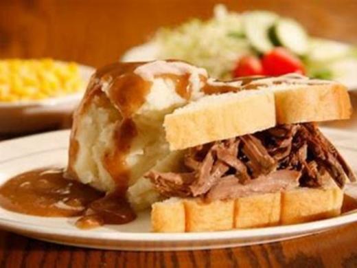 Manhattan Sandwich - A Customer Favorite - Our Manhattan is a platter of goodness made with home-made bread, savory turkey or slow-roasted beef cooked to perfection, creamy mashed potatoes, and top... Photo 4