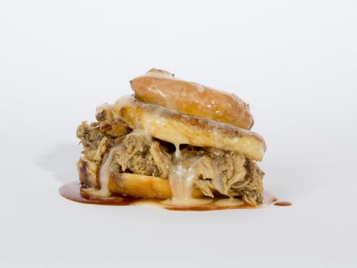 Our Famous Sticky Pig Sandwich - Succulent slow smoked Pulled Pork on a scratch made Glazed Cinnamon Bun Donut. Photo 2