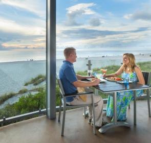 couple eating outside with gulf view