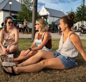 Women sitting on the grass at Waterside Ranch