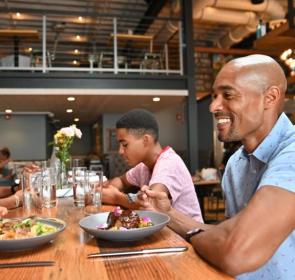 Family eating dinner at Boca Restaurant in Sarasota