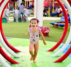 Girl running through water at Payne Park