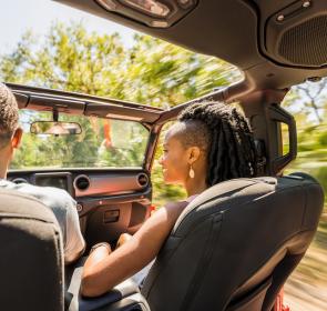 couple driving through state park