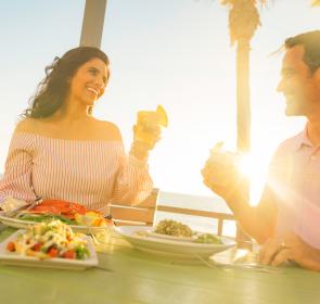 Couple toasting at Fins at Sharky's in Venice