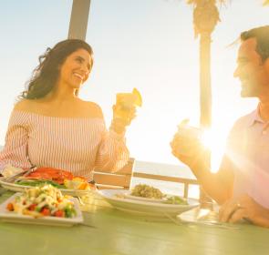 Couple toasting at Fins at Sharky's in Venice