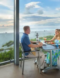 couple eating outside with gulf view