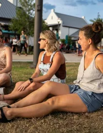 Women sitting on the grass at Waterside Ranch