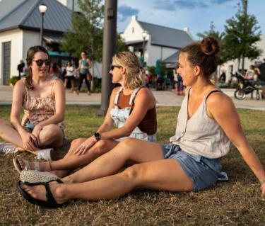 Women sitting on the grass at Waterside Ranch