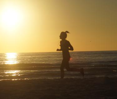 Running On The Beach. Photo credit: Robin Draper.