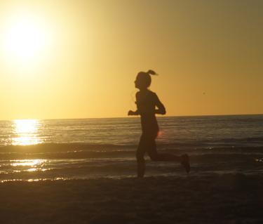Running On The Beach. Photo credit: Robin Draper.