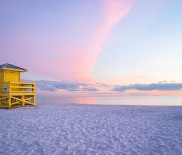 The Siesta Key Yellow Lifeguard Stand at sunset