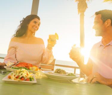 Couple toasting at Fins at Sharky's in Venice