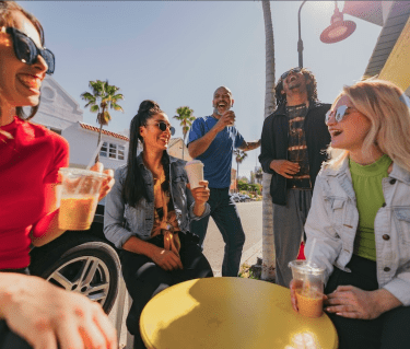 group of young people having coffee in downtown