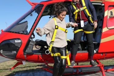 Couple getting out of a helicopter