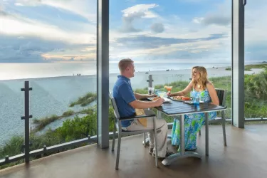 couple eating outside with gulf view