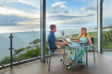 couple eating outside with gulf view
