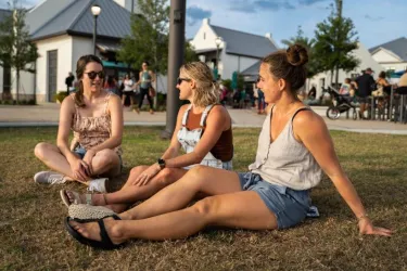 Women sitting on the grass at Waterside Ranch
