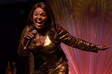 Cast Member Jannie Jones Singing.