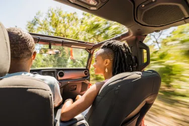 couple driving through state park