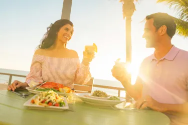 Couple toasting at Fins at Sharky's in Venice