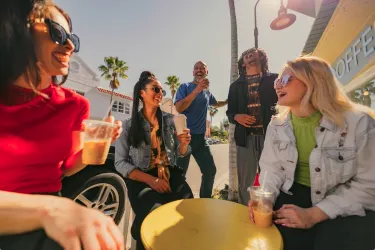 group of young people having coffee in downtown