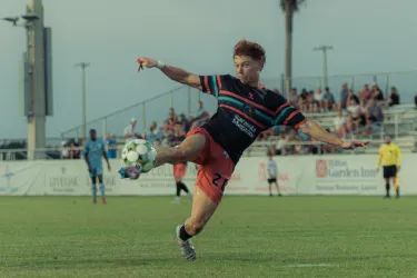 Sarasota Paradise player kicking a ball