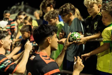 Sarasota Paradise players signing autographs