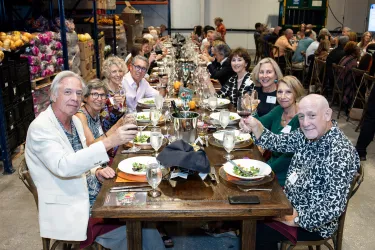 Guests enjoying the 2024 Autumn Harvest Dinner at All Faiths Food Bank
