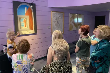 people viewing art on display at the Van Wezel