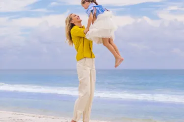Mom on beach with child