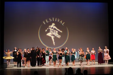 Adult dancers performing on stage at the Thalhe International Dance Festival at Sarasota Opera House.