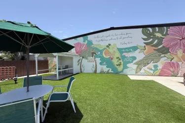 Pinecraft mural outside of pie craft coffee co