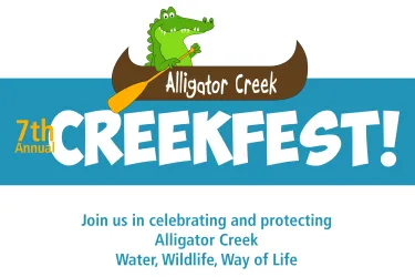 cartoon alligator paddling a canoe over the text: 7th Annual Alligator Creek Fest Join us in celebrating and protecting Alligator Creek, Water, Wildlife, Way of Life