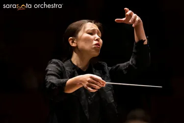 Sarasota Orchestra conductor holding baton