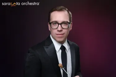 Sarasota Orchestra conductor smiles