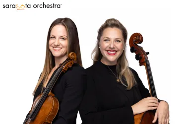 Sarasota Orchestra musicians smile while holding instruments