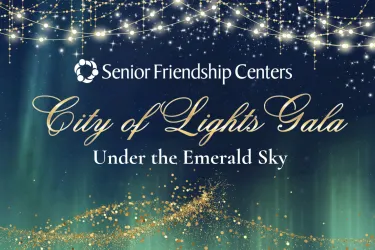 Senior Friendship Centers City of Lights Gala graphic featuring a dark blue and emerald green night sky with glowing stars, hanging gold and white lights, and gold sparkles. Text reads “City of Lights Gala: Under the Emerald Sky.”