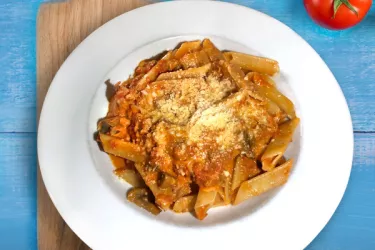 Trenne Dolce Italia - Our signature specialty- triangle pasta with creamy tomato sauce, mozzarella, tomatoes, mushrooms, and parmigiano. Can add sausage or meatballs. Photo