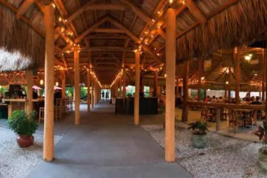 Iconic Chickee Hut Destination in Sarasota, Florida - The Iconic Stottlemyer Smokehouse is a Chickee Hut styled after the original native American chickee huts. The thatched roof allows air to pass... Photo