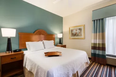 Guest Room - Enjoy an amazing night's sleep in our standard guestrooms. Keep in touch with free WiFi. Coffee maker, refrigerator and microwave in all rooms. Photo